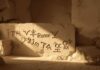 ancient nordic runes carved in stone atmospheric lighting