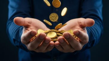 open hands releasing golden coins symbolizing wealth and possessions